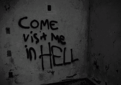 a black and white photo of a wall with the words `` come visit me in hell '' written on it .