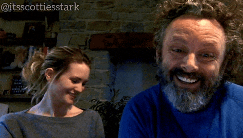 a man with a beard is smiling next to a woman with the words you moot-ivate me below him