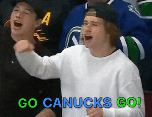 a man shouting go canucks go in a crowd