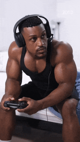 a man wearing headphones playing a video game