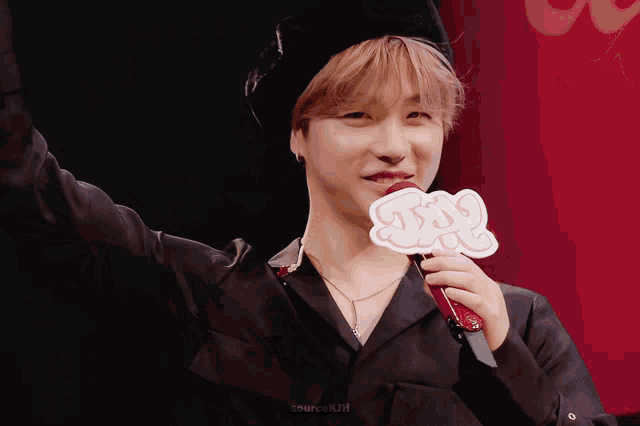 a man holding a sign that says yes