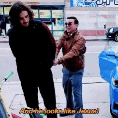 a man standing next to another man with the words and he looks like jesus on the bottom