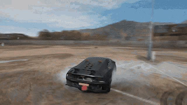 a black car with a license plate that says ' nc ' on it is driving down a dirt road
