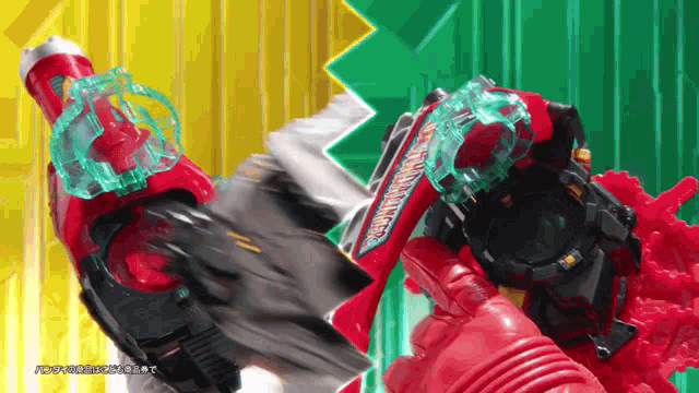 a red toy with the word rangers on it is being held by a person