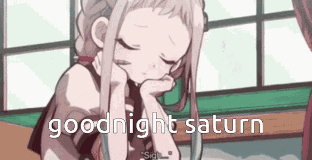 a girl is sleeping in a room with the words `` goodnight saturn '' written on the bottom of the image .