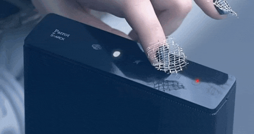 a person is pressing a button on a parrot shark device