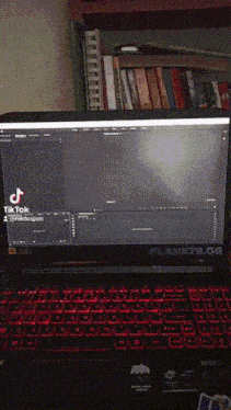 a laptop with a tiktok icon on the screen
