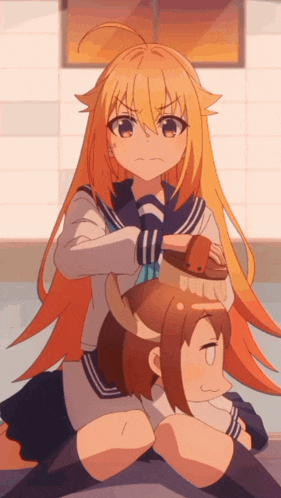 a girl with long blonde hair is sitting on another girl 's back