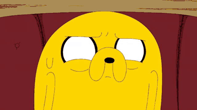 a close up of a cartoon character 's face with a white eye