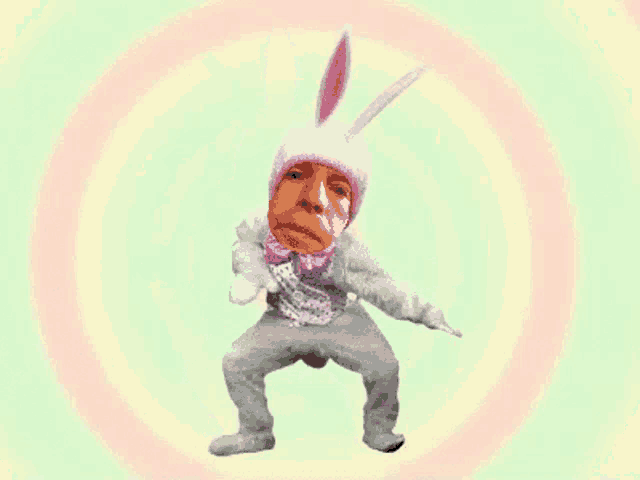 a man in a bunny costume is dancing in front of a rainbow