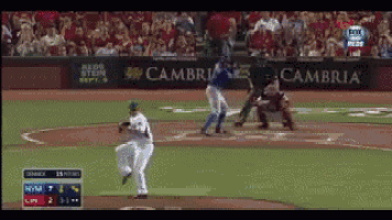 a baseball game is being played in front of a banner that says cambria