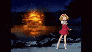 a girl in a red dress stands in front of a building with chinese writing on it