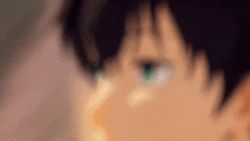 a close up of a person 's green eyes