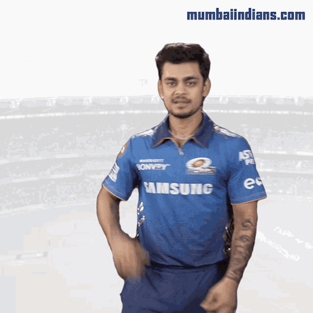 a man wearing a blue samsung shirt is dancing