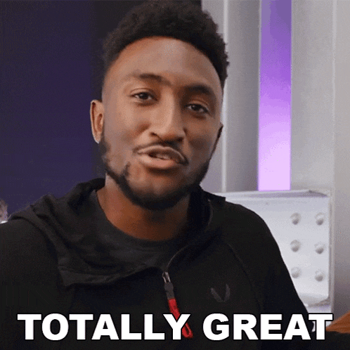 a man in a black jacket is saying totally great