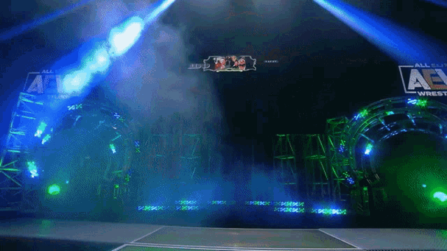 a stage with a sign that says aew on it