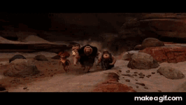a group of people running in the desert with make a gif.com written on the bottom