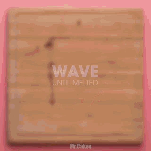 a wooden bowl filled with chopped nuts sits on a pink table