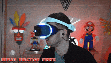 a man wearing a virtual reality headset with the words replay reaction vink 'k above him
