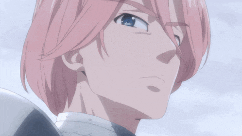 a man with pink hair and blue eyes looks down