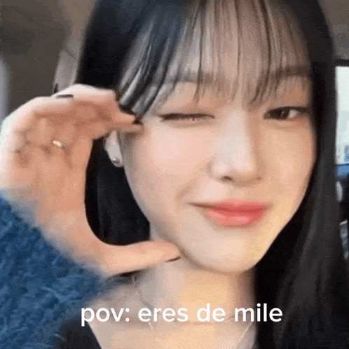 a close up of a woman 's face with the words pov : eres de mile below her
