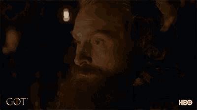 a close up of a man 's face with a hbo logo in the background