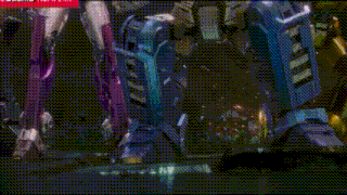 a group of transformers are standing next to each other on a table .