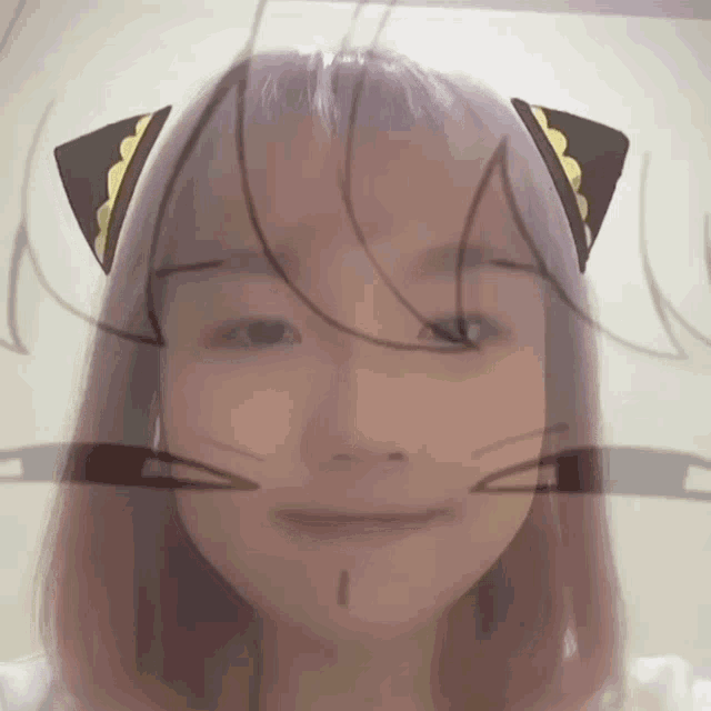 a girl with pink hair has a cat ear sticker on her head