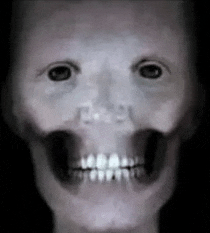 a close up of a person 's face with a skull and teeth .