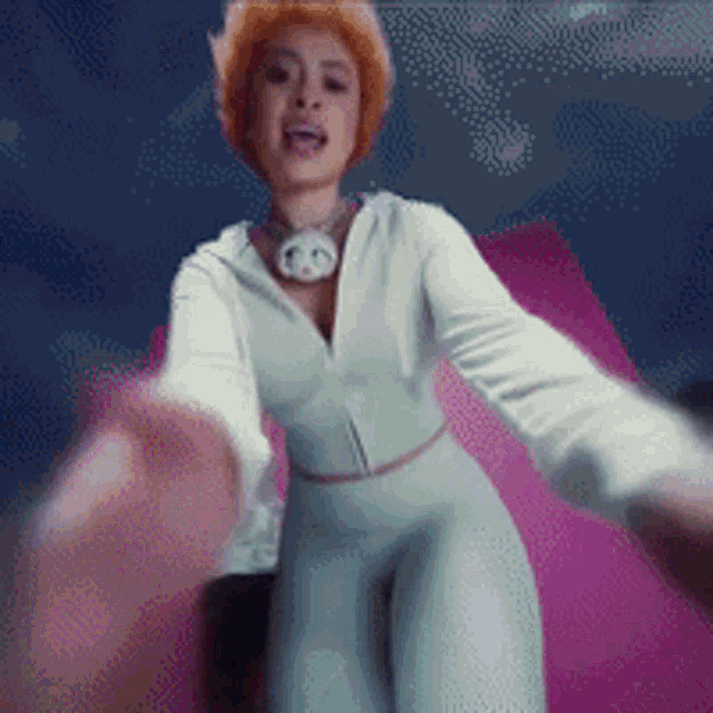 a pixelated image of a woman in a white jumpsuit