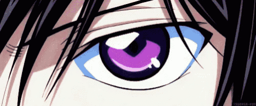 a close up of a person 's eye with blue and purple eyes