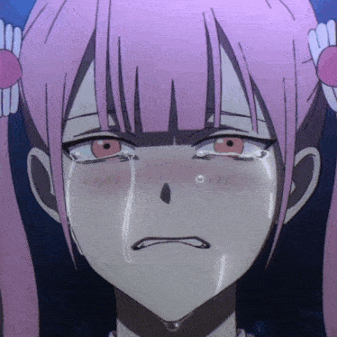 a girl with pink hair is crying with her eyes closed