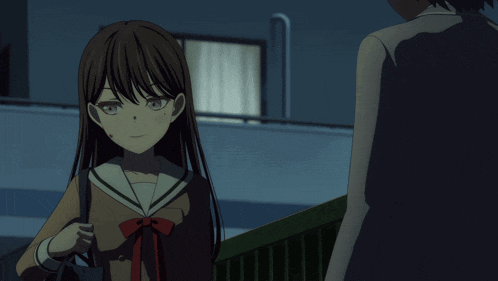 a girl in a school uniform is standing next to a man
