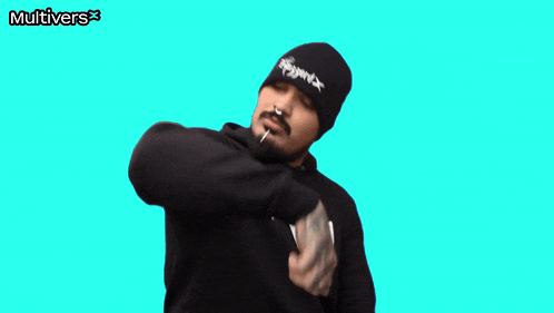 a man wearing a black beanie and a black hoodie with the word multivers on the bottom