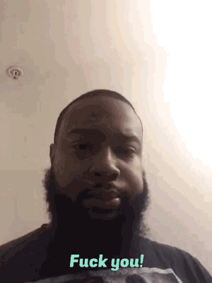 a man with a beard and a black shirt says fuck you