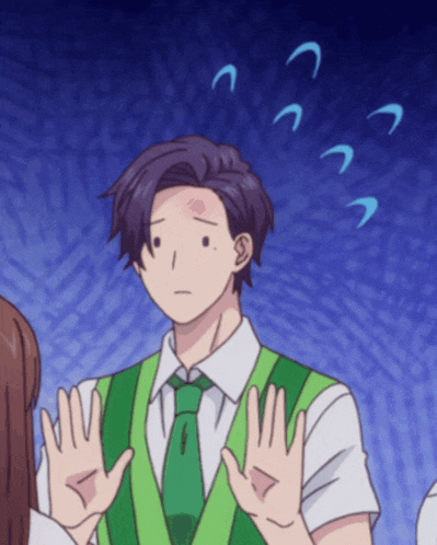 a man in a green vest and tie is making a face