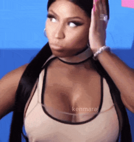 a close up of a woman 's face with the name kenmaraj written on the bottom