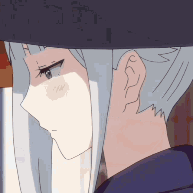 a close up of a person 's face with white hair and a purple shirt