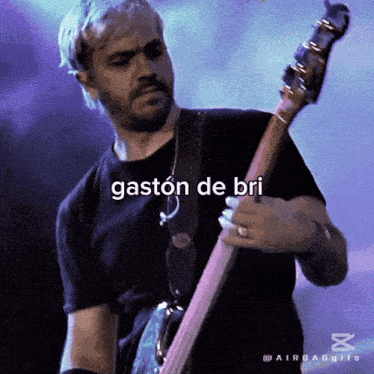 a man playing a guitar with the words gaston de bri written on the bottom