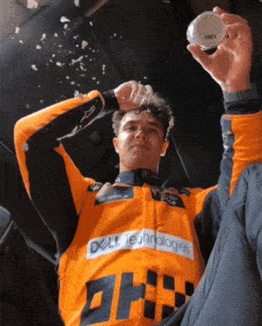 a man wearing an orange dell technologies shirt