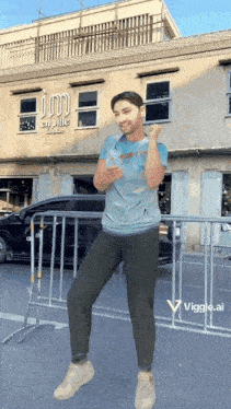 a man is standing in front of a building that says ' en ville ' on it