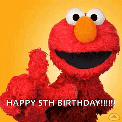 elmo from sesame street is giving a thumbs up .