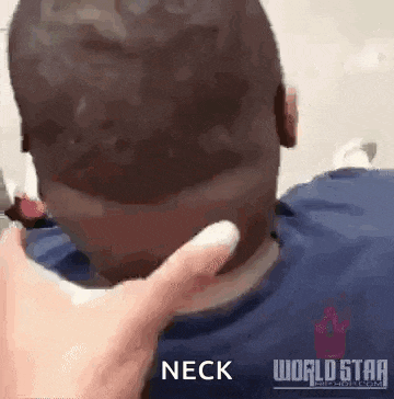 a man 's neck is being touched by a person 's hand .