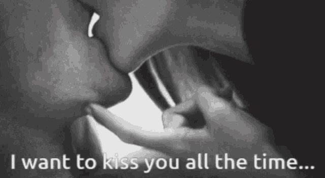 a black and white photo of a couple kissing with the words " i want to kiss you all the time "