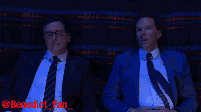 two men in suits and ties are sitting next to each other and benedict fan is written on the bottom of the image