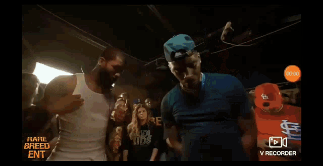 a group of people are dancing in a room with the words rare breed ent on the screen