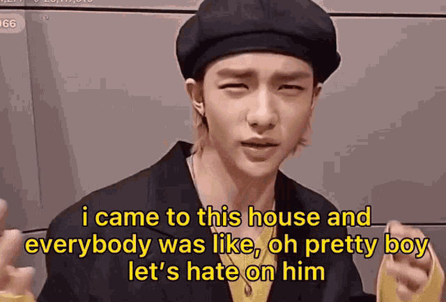 a young man wearing a black beret is making a funny face and saying i came to this house