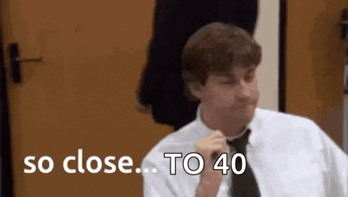 a man in a white shirt and black tie is adjusting his tie and saying `` so close ... to 40 '' .