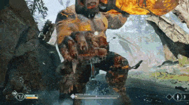 a screenshot of a video game shows a giant holding a hammer in his hand .