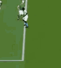 a group of soccer players are on a field with the words foul or fanny written above them .